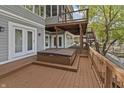 Back deck with hot tub and staircase leading to the lake at 11226 Blackwalnut Pt, Indianapolis, IN 46236
