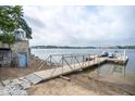 Picturesque waterfront property with a private dock and lighthouse, providing direct lake access and scenic views at 11715 Landings Dr, Indianapolis, IN 46256
