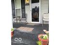 Inviting front porch with cozy seating and charming decor at 1517 S Reisner St, Indianapolis, IN 46221