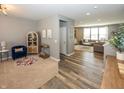 Open-concept living room with modern decor, plush seating, and stylish flooring at 16419 Connolly Dr, Westfield, IN 46074
