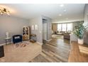 Spacious living room connects to a sitting area and offers an open layout to the kitchen at 16419 Connolly Dr, Westfield, IN 46074