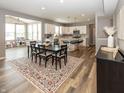 Spacious open-concept design with modern kitchen, dining area, and playroom filled with natural light at 16419 Connolly Dr, Westfield, IN 46074