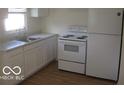 Well-lit kitchen featuring stainless steel appliances and white cabinetry at 201 W Essex St, Lebanon, IN 46052