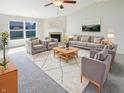 Bright and airy living room with large windows, stylish decor, and cozy seating at 2913 Lily Dr, Lebanon, IN 46052