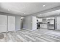 Open-concept living room and kitchen with stainless steel appliances at 3072 Falcon Dr, Indianapolis, IN 46222