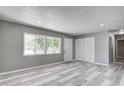 Bright living room with large windows and stylish flooring at 3072 Falcon Dr, Indianapolis, IN 46222