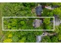 Aerial view of property showcasing a large, treed lot and surrounding neighborhood at 3230 Amherst St, Indianapolis, IN 46268