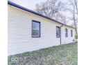 View of exterior of the side of the home showing the window trim and brick at 3342 Foltz St, Indianapolis, IN 46221