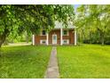 Classic brick home with a well-maintained lawn and inviting front entrance at 502 S Harrison St, Alexandria, IN 46001