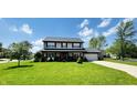 Charming two-story home with a well-manicured lawn, and attached two car garage at 932 Eagle Brook Cir, Shelbyville, IN 46176