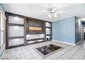 Bright living room with custom built-in shelving and decorative tile accents at 1170 N Concord St, Indianapolis, IN 46222