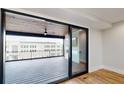 Spacious outdoor deck features a wood-paneled ceiling and a sliding glass door entry at 120 First Ne Ave, Carmel, IN 46032