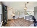 Spacious open-concept living area with gray walls, stylish gray flooring, neutral furniture, and an open floor plan at 12993 E 131St St, Fishers, IN 46037