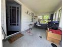 Enclosed front porch filled with seating and furniture at 144 S 7Th Ave, Beech Grove, IN 46107