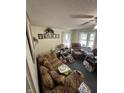 Cozy living room with comfortable seating and natural light from the window at 1801 E 16Th St, Muncie, IN 47302