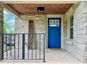 Close up of welcoming front porch, with a blue door and stone accents at 1920 E Epler E Ave, Indianapolis, IN 46227