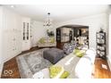 Bright living room with hardwood floors, fireplace, built-in shelves and an open layout at 21218 Carlton Ct, Noblesville, IN 46062