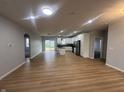 Spacious open-concept kitchen with white cabinets, island, and stainless steel appliances at 223 N Coventry Dr, Anderson, IN 46012