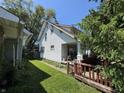Quaint two-story home with white siding and a charming covered porch at 254 N Mount St, Indianapolis, IN 46222
