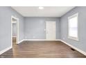 Bright living room features new floors, fresh paint, and ample natural light at 3109 E St Joseph St, Indianapolis, IN 46201