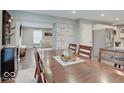 Open concept dining area with modern decor flowing into living space at 3659 Watson Rd, Indianapolis, IN 46205