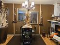 Cozy dining area featuring a unique table setting, decorative mirrors, and warm lighting at 4962 Potomac Square Pl, Indianapolis, IN 46268