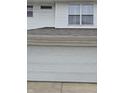 Spacious garage door with a clean and modern design, ready for parking and storage at 4962 Potomac Square Pl, Indianapolis, IN 46268
