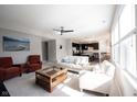 Spacious living room featuring neutral tones, stylish furniture, and a ceiling fan at 635 Sonoma Ln, Greenfield, IN 46140