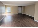 Spacious living room with wood floors, neutral walls, and a bright window at 6715 Shanghai Cir, Indianapolis, IN 46278