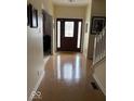 Inviting foyer with gleaming wood floors and staircase at 8130 Winterset Cir, Indianapolis, IN 46214