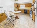 Traditional kitchen featuring wood cabinetry, a breakfast nook and vintage tile flooring at 814 Walnut St, Anderson, IN 46012