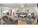 Inviting living room with open layout, modern furnishings, and seamless flow to kitchen at 8904 Browns Valley Ln, Camby, IN 46113