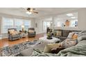 Comfortable living room with plush seating, decorative rug, and bright natural light at 8904 Browns Valley Ln, Camby, IN 46113