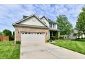 Well-maintained two-story home with brick accents, a spacious driveway and manicured lawn at 938 Weeping Way Ln, Avon, IN 46123