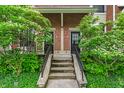 Inviting front entrance with lush greenery and stairs leading to the front door at 1064 Reserve Way, Indianapolis, IN 46220