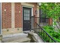 Charming front door with glass detailing and brick facade at 1064 Reserve Way, Indianapolis, IN 46220