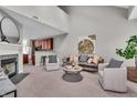 Bright living room featuring a fireplace, neutral decor, and modern furniture at 1064 Reserve Way, Indianapolis, IN 46220