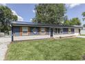Inviting blue home with a well-maintained lawn, stone foundation and wood accents at 1082 Galaxie Dr, Greenwood, IN 46142