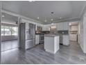 Spacious kitchen with stainless steel appliances, white cabinets, and a center island at 1082 Galaxie Dr, Greenwood, IN 46142