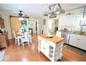 Inviting kitchen with a center island, stainless steel appliances, and a dining area with a barn door at 12144 Trolley Rd, Indianapolis, IN 46236