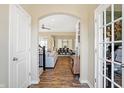 Hallway with hardwood floors that opens to the living and dining area at 15116 Fenchurch Dr, Westfield, IN 46074