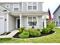 Inviting front porch with rocking chairs and lovely landscaping, perfect for relaxing outdoors at 1880 Explorer Ct, Franklin, IN 46131