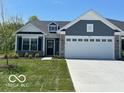 Charming single-story home showcasing a 2-car garage, stone accents, and beautiful curb appeal at 19584 Atwater Ave, Sheridan, IN 46069