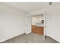 Home office with carpet and French doors leading to a modern kitchen area at 19584 Atwater Ave, Sheridan, IN 46069