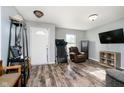 Inviting living room with hard surface floors, natural light, and home entertainment area at 2258 Bridlewood Dr, Franklin, IN 46131