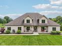 Charming home with a well-manicured lawn and a welcoming front porch at 2825 S State Road 267, Plainfield, IN 46168
