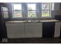 Modern kitchen with white cabinets, and stainless steel appliances at 2968 N Arsenal Ave, Indianapolis, IN 46218
