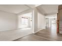 Bright living room featuring carpet, a large window, and an open floor plan at 3419 Burlingame Blvd, Carmel, IN 46074