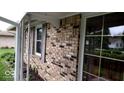 Charming exterior showcasing brick facade, black shutters, and well-maintained landscaping at 3702 Candy Cane Dr, Indianapolis, IN 46227