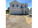Two-story new construction home featuring an attached two-car garage on a sunny day at 3897 Berkdale Ct, Columbus, IN 47203